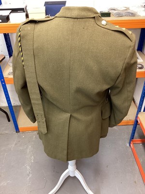 Lot 687 - Royal Army Service Corps Captains Service Dress jacket, together with a Police jacket and various R.A.F uniform in a canvas bag.