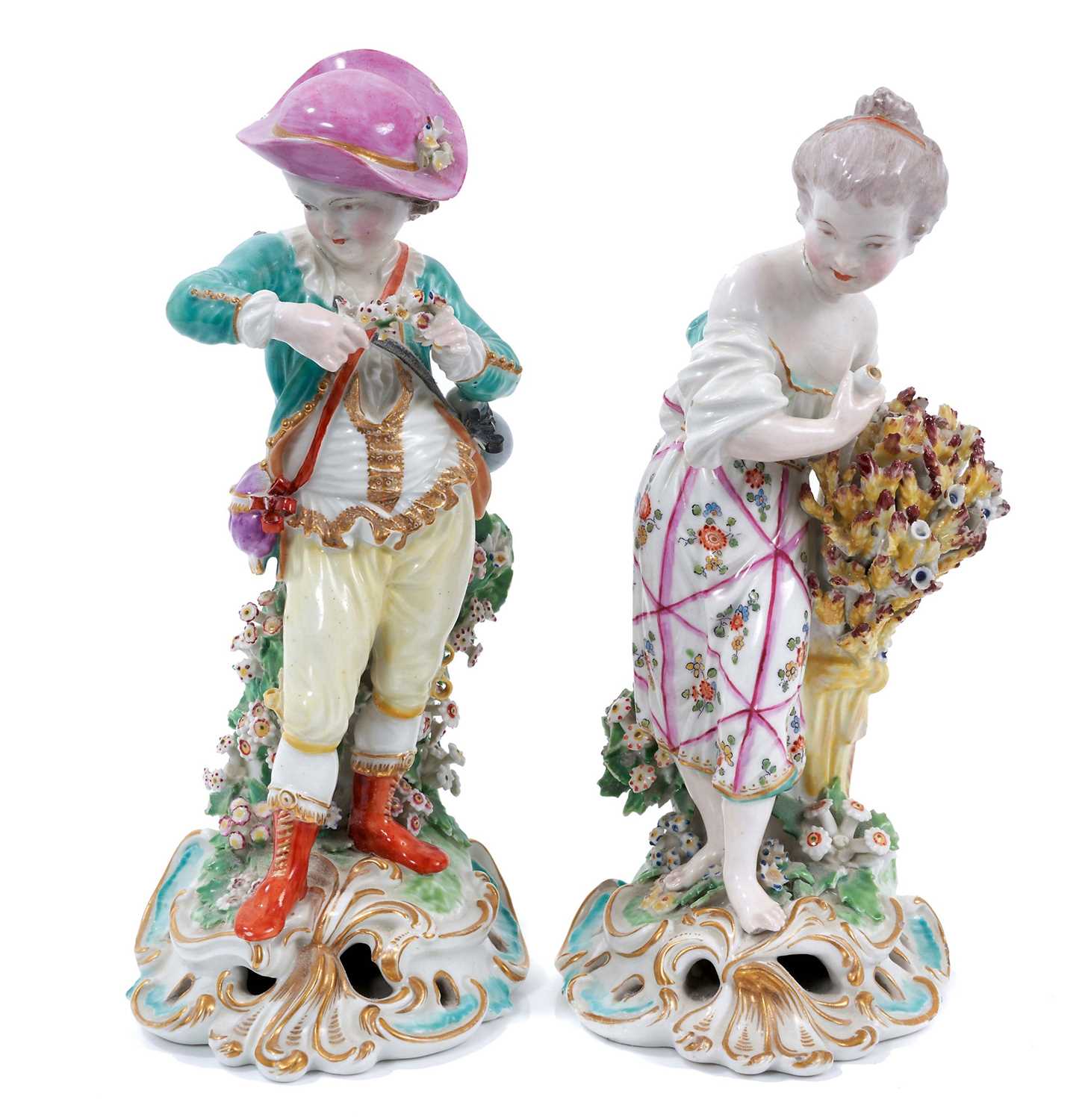 Lot 12 - Two late 18th century Derby figures, emblematic of Spring and Summer, polychrome decorated and standing on scrollwork bases, 22.5cm and 23.5cm high