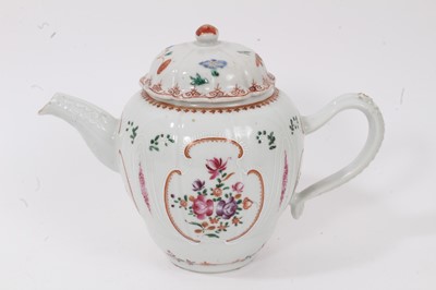 Lot 14 - 18th century Chinese famille rose porcelain teapot, decorated with flowers, together with a tea bowl and saucer decorated in the Mandarin style (3)