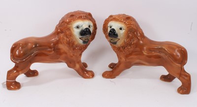 Lot 46 - Two pairs of Victorian Staffordshire pottery lions