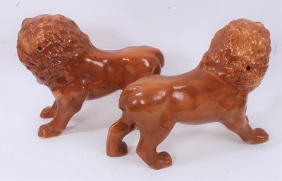Lot 46 - Two pairs of Victorian Staffordshire pottery lions
