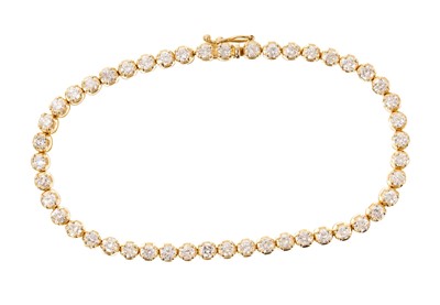 Lot 729 - Diamond tennis bracelet with 47 round brilliant cut diamonds in 18ct yellow gold claw setting, with integral clasp and safety loop. Hallmarked London 1975. Estimated total diamond weight approximat...