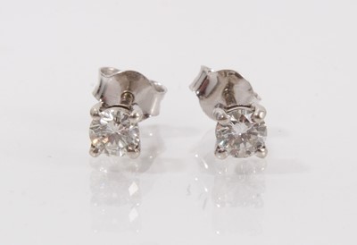 Lot 368 - A pair of diamond stud earrings, each with a round brilliant cut diamond in 9ct white gold four claw setting. Estimated total diamond weight approximately 0.54cts.