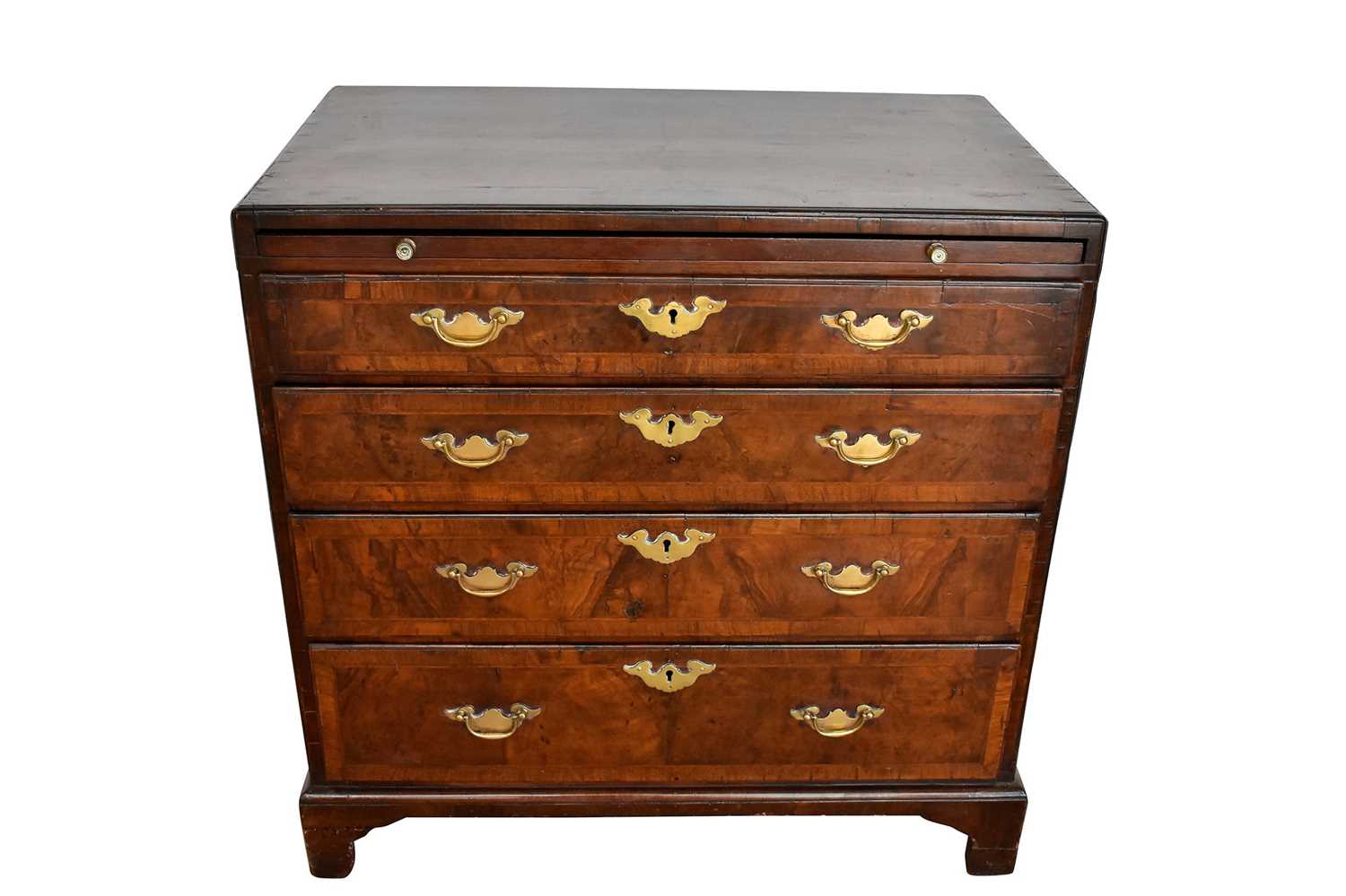 Lot 1116 - George I walnut and crossbanded chest of drawers, with caddy moulded top and brushing slide over four graduated drawers on bracket feet, 75cm wide x 44cm deep x 77cm high