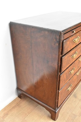 Lot 1116 - George I walnut and crossbanded chest of drawers, with caddy moulded top and brushing slide over four graduated drawers on bracket feet, 75cm wide x 44cm deep x 77cm high