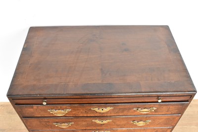 Lot 1116 - George I walnut and crossbanded chest of drawers, with caddy moulded top and brushing slide over four graduated drawers on bracket feet, 75cm wide x 44cm deep x 77cm high