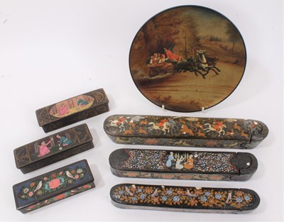 Lot 555 - Three 19th century Indo-Persian papier-mâché scribe's boxes, each of typical rounded rectangular form, decorated with figural reserves the largest 27cm long, together with three similar lidded boxes