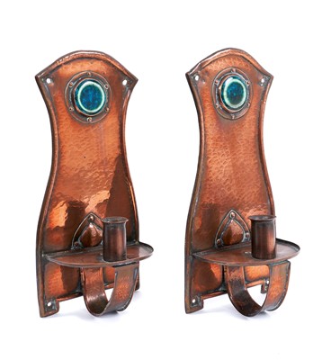 Lot 585 - Pair of Arts and Crafts copper wall sconces, each with Ruskin style cabochon inset ceramic boss, 30cm high