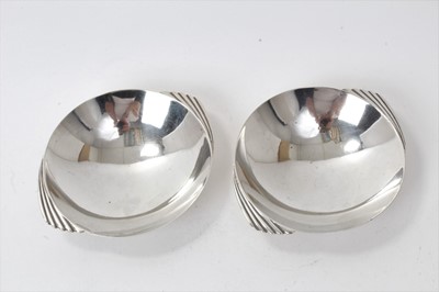 Lot 207 - Pair 1940s silver Art Deco style silver dishes of circular form with wing handles