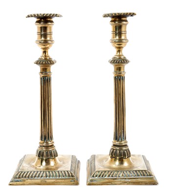 Lot 621 - Pair of early George III paktong candlesticks