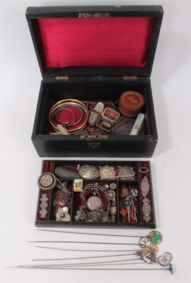 Lot 337 - A Victorian jewellery box containing a good collection of Victorian and Edwardian silver jewellery to include a Victorian silver posy holder/brooch, Victorian silver locket, Victorian name brooches...