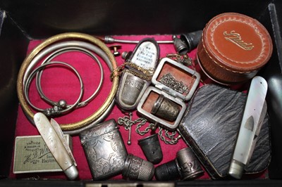 Lot 337 - A Victorian jewellery box containing a good collection of Victorian and Edwardian silver jewellery to include a Victorian silver posy holder/brooch, Victorian silver locket, Victorian name brooches...