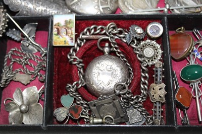 Lot 337 - A Victorian jewellery box containing a good collection of Victorian and Edwardian silver jewellery to include a Victorian silver posy holder/brooch, Victorian silver locket, Victorian name brooches...