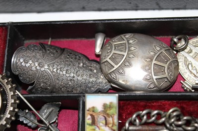 Lot 337 - A Victorian jewellery box containing a good collection of Victorian and Edwardian silver jewellery to include a Victorian silver posy holder/brooch, Victorian silver locket, Victorian name brooches...