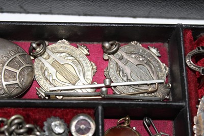 Lot 337 - A Victorian jewellery box containing a good collection of Victorian and Edwardian silver jewellery to include a Victorian silver posy holder/brooch, Victorian silver locket, Victorian name brooches...