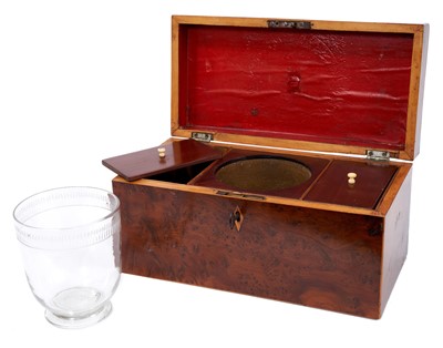 Lot 651 - Early 19th century figured yew wood tea caddy, with glass mixing bowl and flanking lidded compartments, 30cm wide