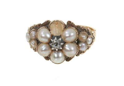 Lot 348 - Regency gold diamond and seed pearl flower cluster ring with a central diamond surrounded by split pearls (one missing) on foliate gold shoulders and reeded gold shank, ring size P½.