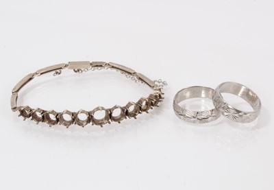 Lot 363 - Two platinum wedding rings and a white metal bracelet stamped '9ct'.