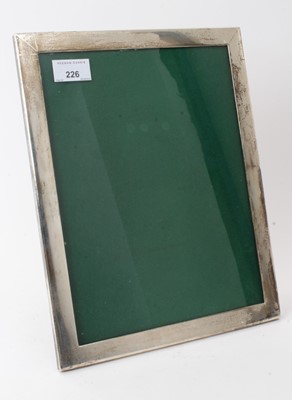 Lot 226 - Continental contemporary silver photograph frame, of plain vertical rectangular form