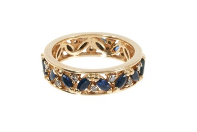 Lot 353 - Sapphire and diamond eternity ring with a full band of marquise cut blue sapphires and brilliant cut diamonds in 18ct gold setting, ring size N½.