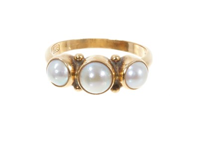 Lot 355 - Georg Jensen 18ct gold and cultured pearl three stone ring, with three half pearls in 18ct gold setting, signed, model number 1003. London import hallmarks for 1967. Ring size N.