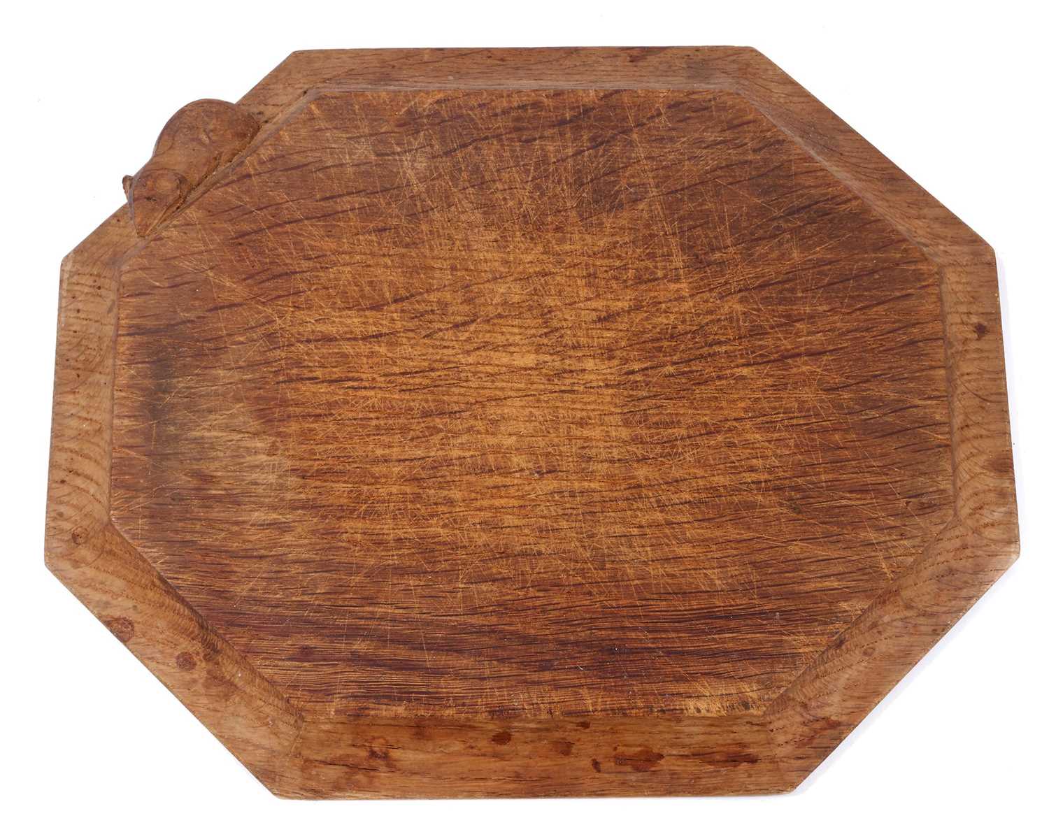 Lot 1401 - Robert 'Mouseman' Thompson carved oak breadboard, of canted form, 31cm wide