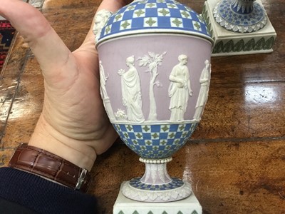 Lot 92 - Rare garniture of three 19th century Wedgwood jasper ware vases