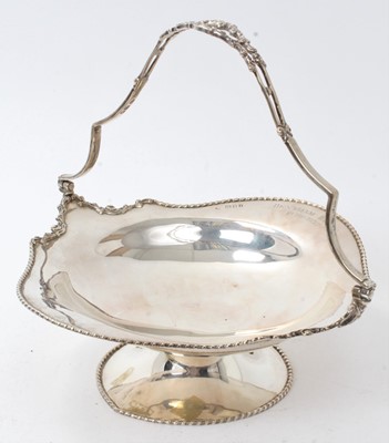 Lot 273 - 1920s silver swing handled basket of shaped form, with ropework border, on a pedestal base