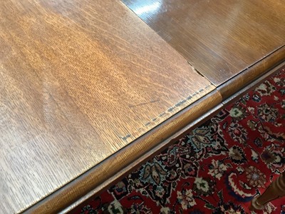 Lot 1205 - Large Edwardian oak extending dining table