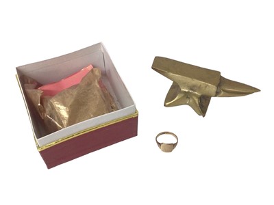 Lot 195 - 9ct gold signet ring, together with gold dust and a small brass anvil