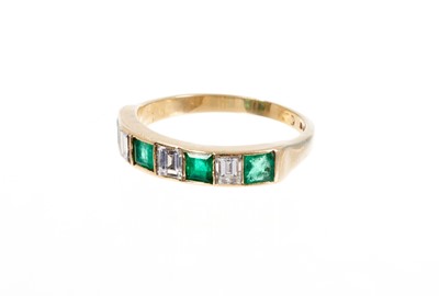 Lot 498 - Gold diamond and emerald seven stone ring