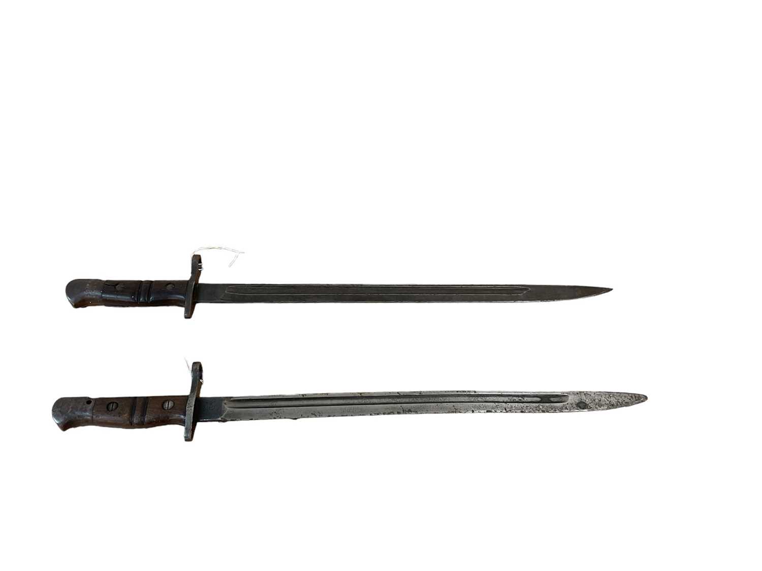 Lot 850 - First World War British 1913 pattern Remington bayonet, dated 4 17, together with an American 1917 pattern bayonet, both lacking scabbards (2).