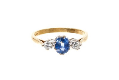 Lot 473 - Sapphire and diamond three stone ring