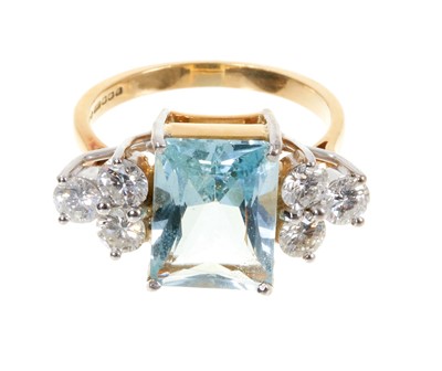 Lot 460 - Aquamarine and diamond ring with a rectangular fancy cut aquamarine flanked by six round brilliant cut diamonds in 18ct gold claw setting on 18ct gold shank