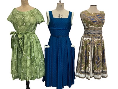 Lot 2108 - 1950's Horrockses blue damask dress with white plush trim, full skirt with narrow belt and bow detail to reverse. Also a 1950's Richard Shops green and white day dress with full skirt and attached...
