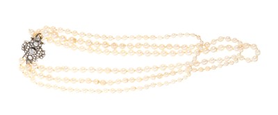 Lot 482 - Triple strand pearl necklace with diamond set clasp