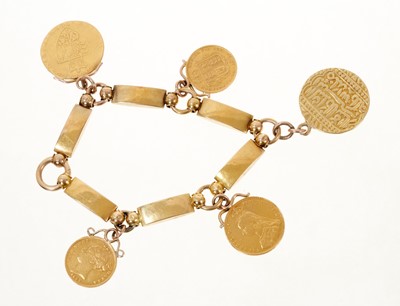 Lot 447 - Gold charm bracelet with five gold coins