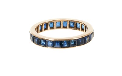 Lot 454 - Sapphire eternity ring with a full band of blue sapphires