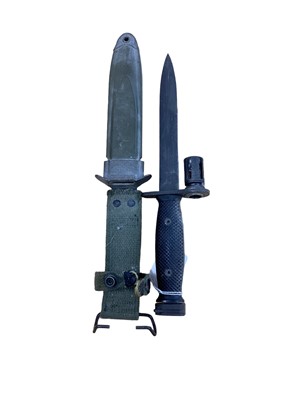 Lot 879 - American M7 bayonet in scabbard with integral webbing frog.