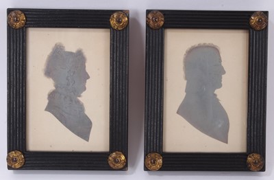 Lot 670 - Pair of Regency paper cut profile portraits