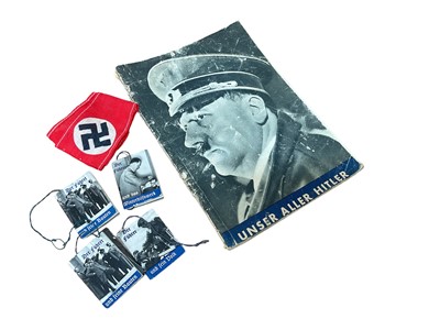 Lot 676 - Nazi swastika red cotton arm band - possibly Hitler Youth or children's, together with four miniature picture books of 'Der Führer' and one period booklet 'Unser Aller Hitler'