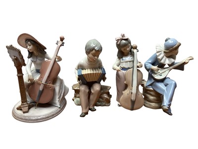 Lot 1130 - Lladro porcelain figure of a lady playing a cello, no.6332, together with three NAO figures all playing musical instruments (4)