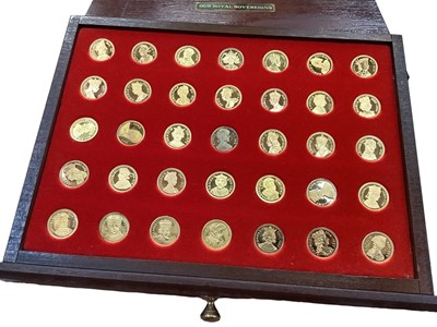 Lot 430 - G.B. - Banbury Mint 'Our Royal Sovereigns' a complete collection of 70 commemorative monarchs with heraldic devices - medaletts struck in sterling silver plated in 22 carat gold in wood case of iss...