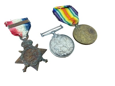 Lot 704 - First World War 1914 'Mons' Star trio comprising 1914 Star, War and Victory medals named to 10491 PTE. E. Knight. C. GDS.