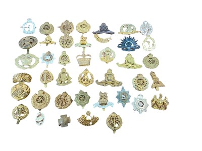 Lot 721 - Collection of forty British Military cap badges, for various regiments including RAF, ATS, Royal Artillery and others. Original and reproductions noted. (40)