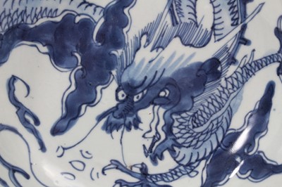 Lot 3 - 18th century Chinese blue and white porcelain plate, decorated with a dragon chasing a flaming pearl, seal mark to base