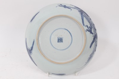 Lot 3 - 18th century Chinese blue and white porcelain plate, decorated with a dragon chasing a flaming pearl, seal mark to base