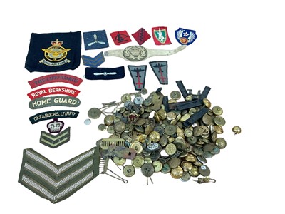 Lot 733 - Collection of cloth military badges and various military buttons.