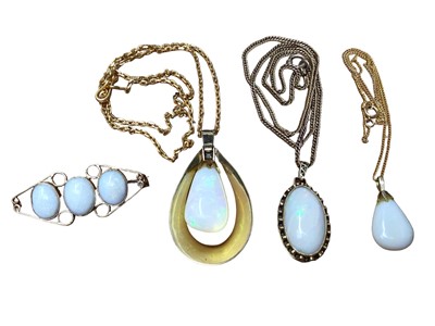 Lot 31 - Two 18ct gold mounted opal pendants on yellow metal chains, 18ct gold mounted opal three stone brooch and one other opal pendant on 9ct gold chain
