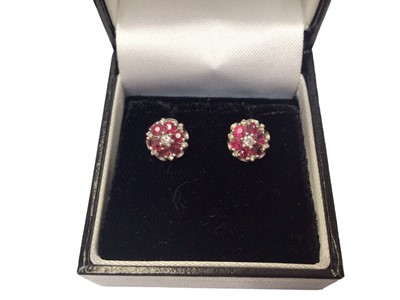 Lot 37 - Group of gold gem set earring to include a pair of 18ct gold synthetic star sapphire and star ruby floral spray earrings, pair of 18ct white gold ruby and diamond cluster earrings
